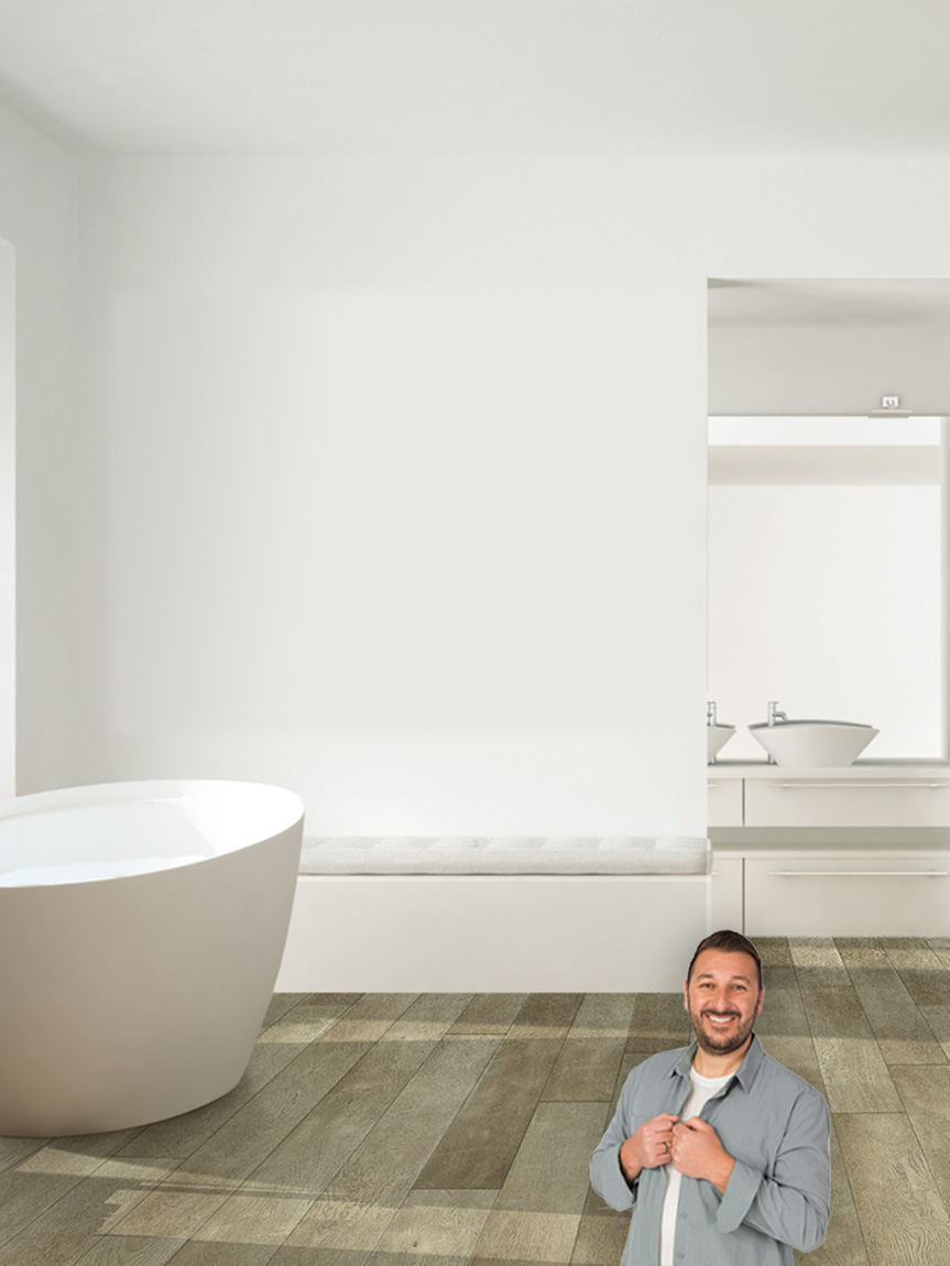Locally Owned Flooring store owner Brent showing new flooring in bathroom