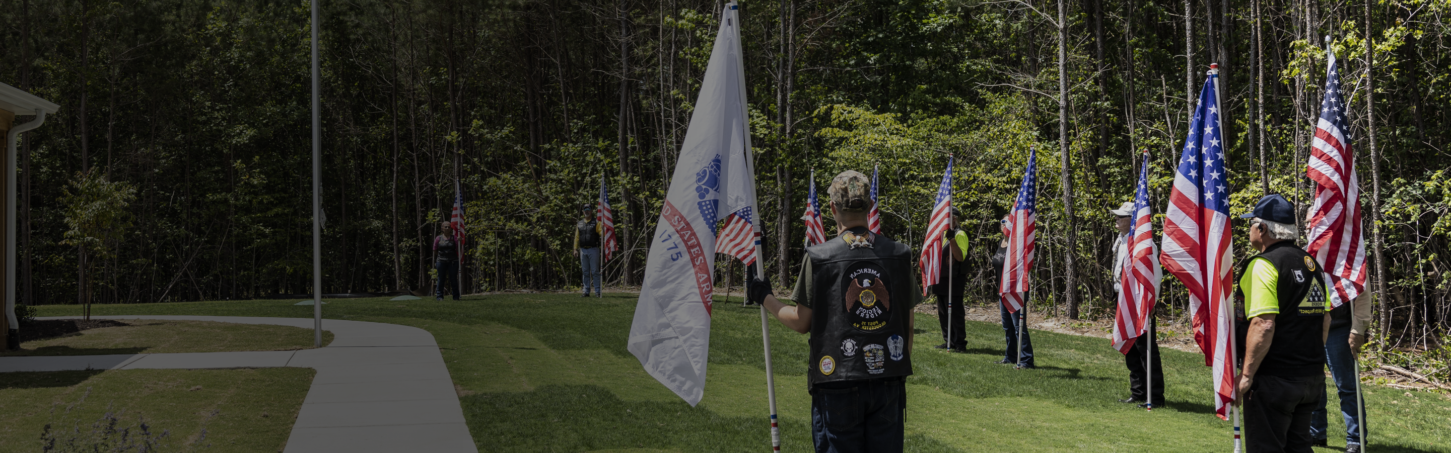 service members holder American flags